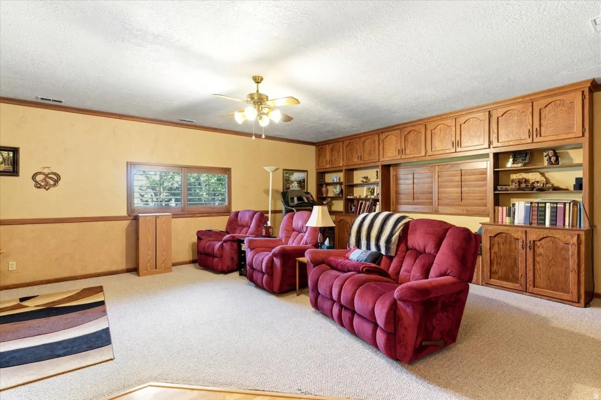 Expansive room with extensive built-in wood cabinetry and shelving, offering significant storage solutions