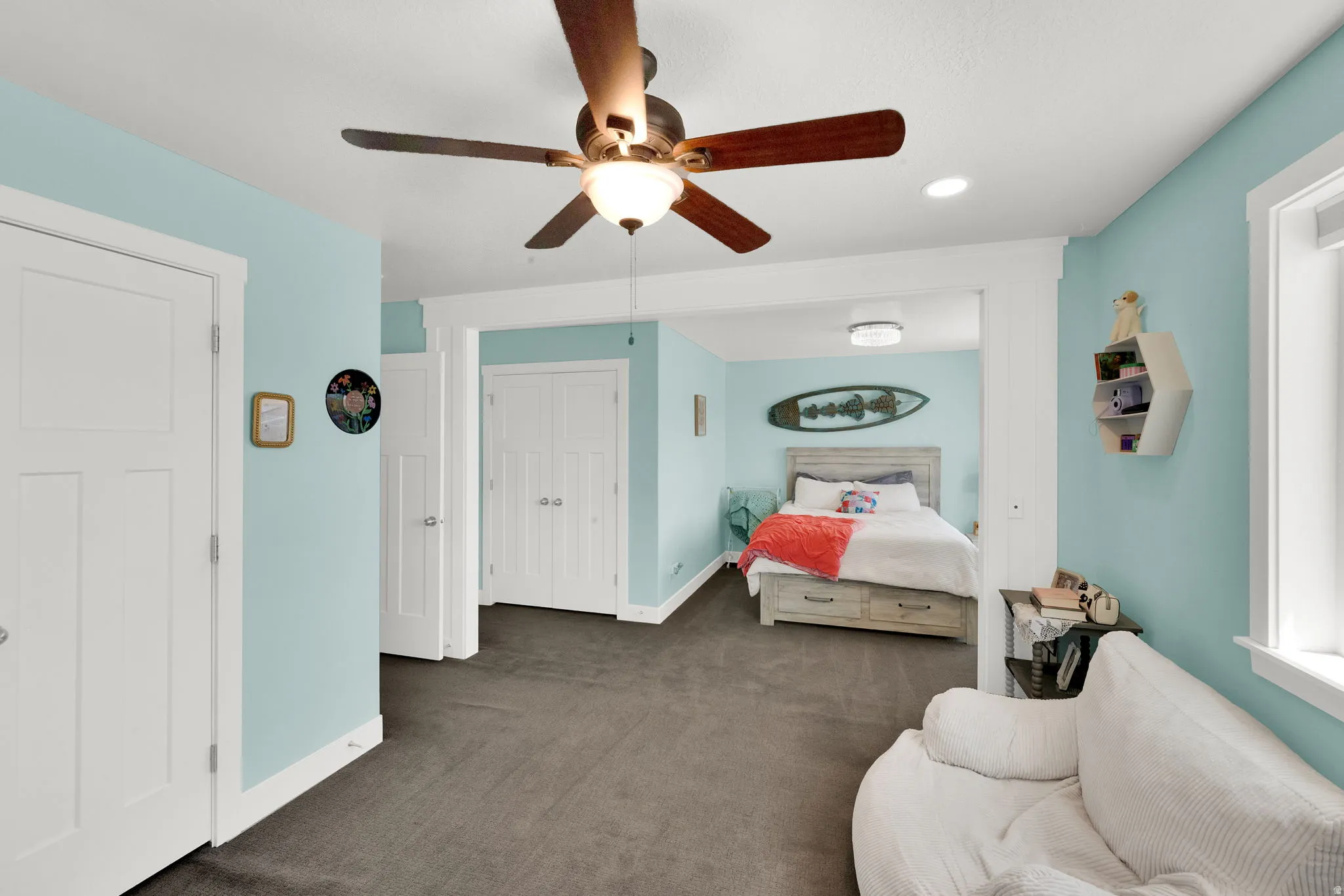 Carpeted room with a ceiling fan, recessed lighting, and light blue walls