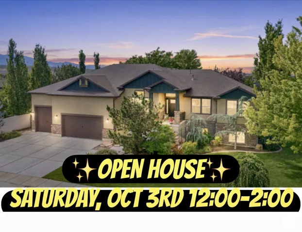Stucco and stone exterior, multi-car garage, pitched roofline, established landscaping, and a concrete driveway