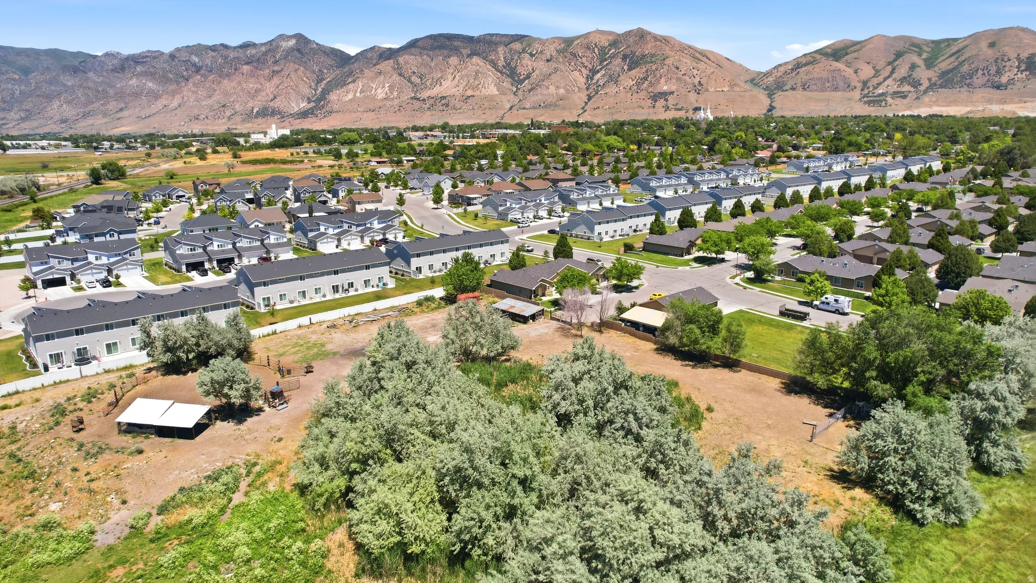 Residential area featuring a variety of housing styles, including multi-unit townhomes and single-family residences