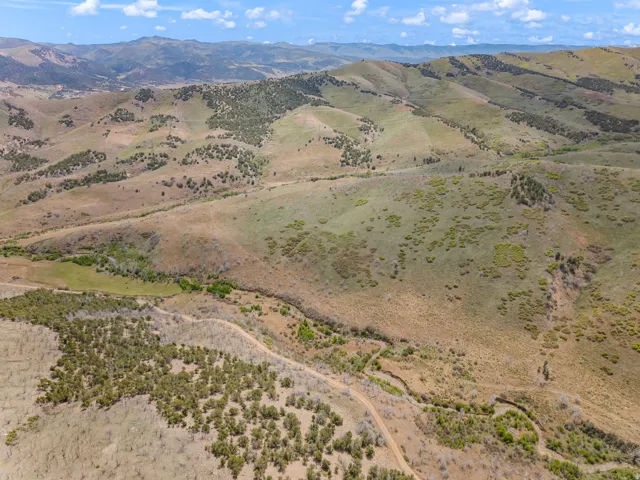 Expansive mountainous terrain with varied vegetation