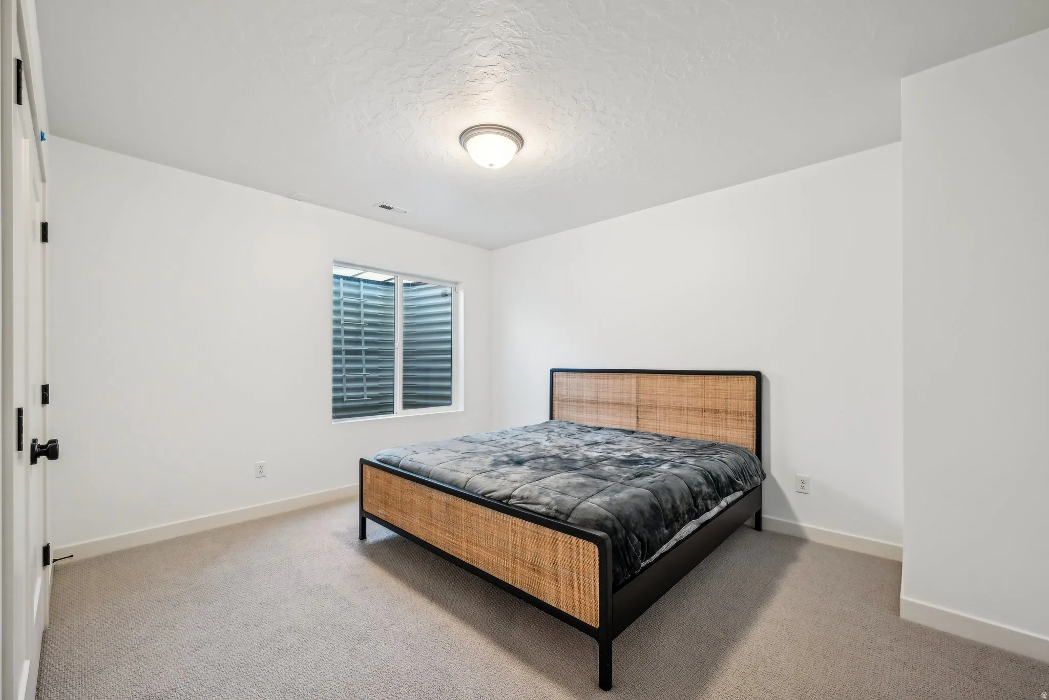 Neutral-toned carpet flooring complementing white painted walls