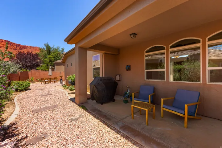 Covered patio with integrated lighting and three arched windows