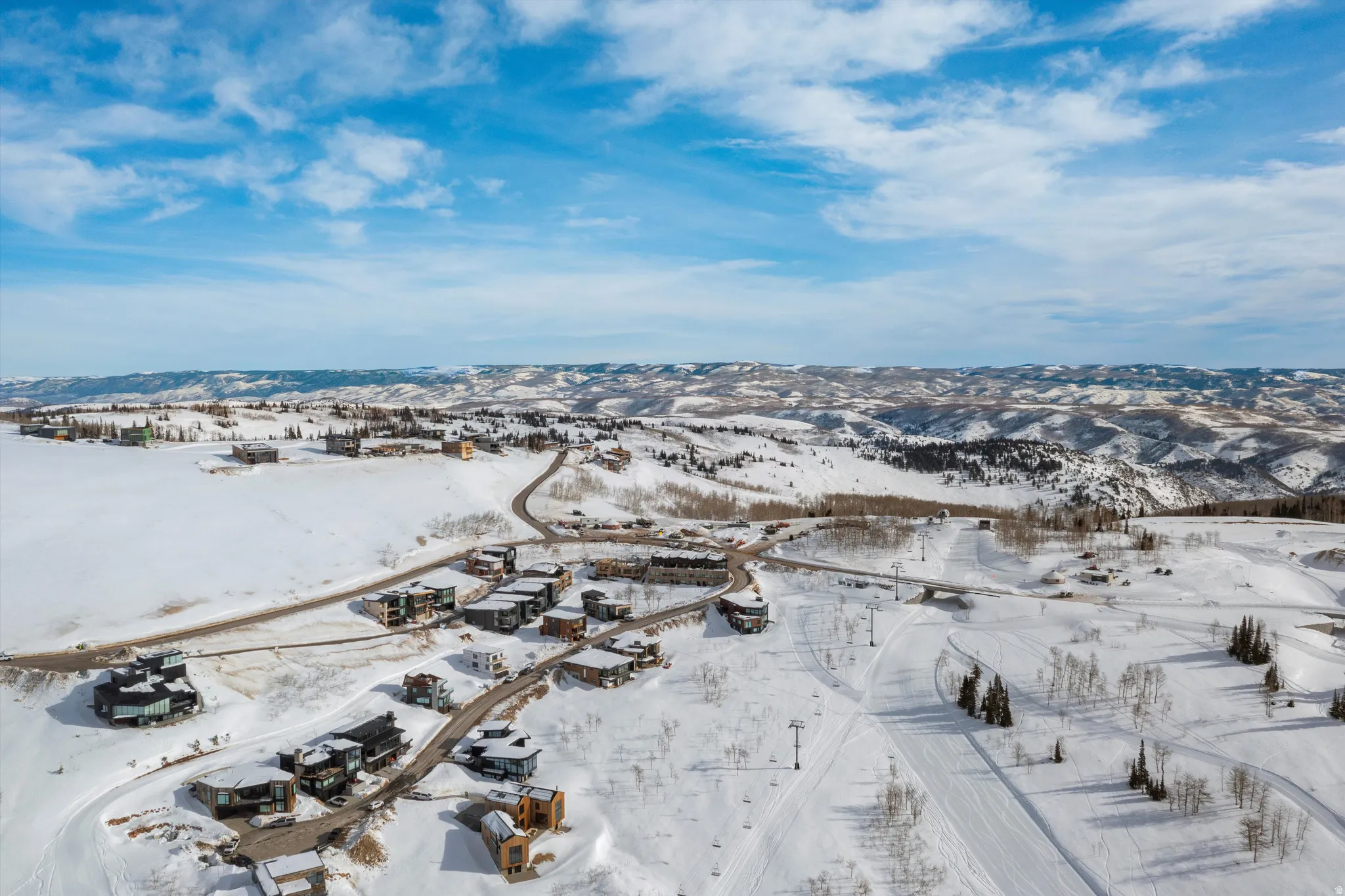 Snowy aerial view featuring a mountain view