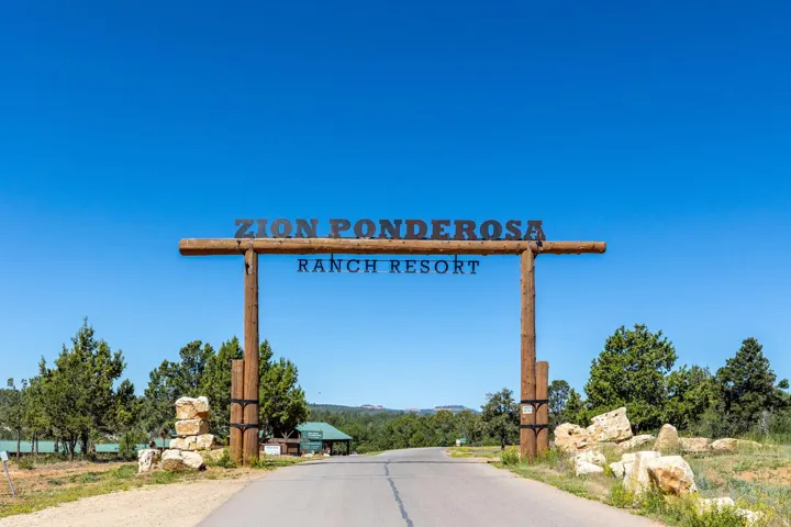 Rustic timber-framed entrance sign to Zion Ponderosa Ranch Resort