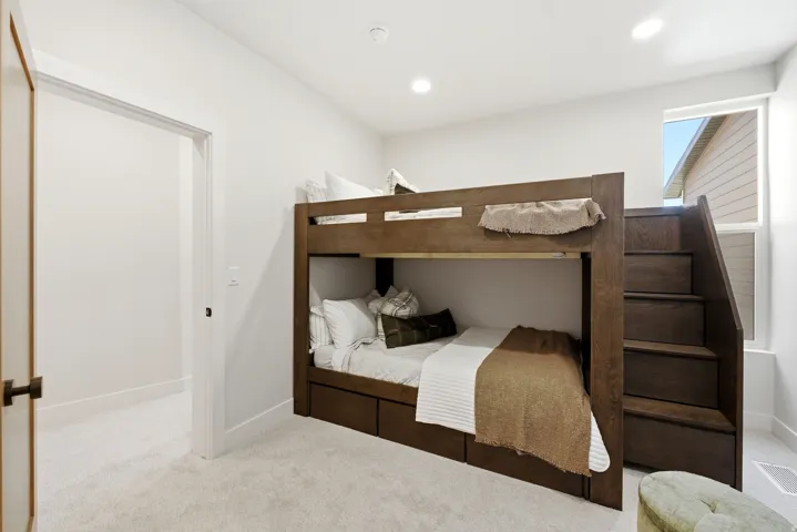 Built-in bunk bed with integrated staircase and storage drawers
