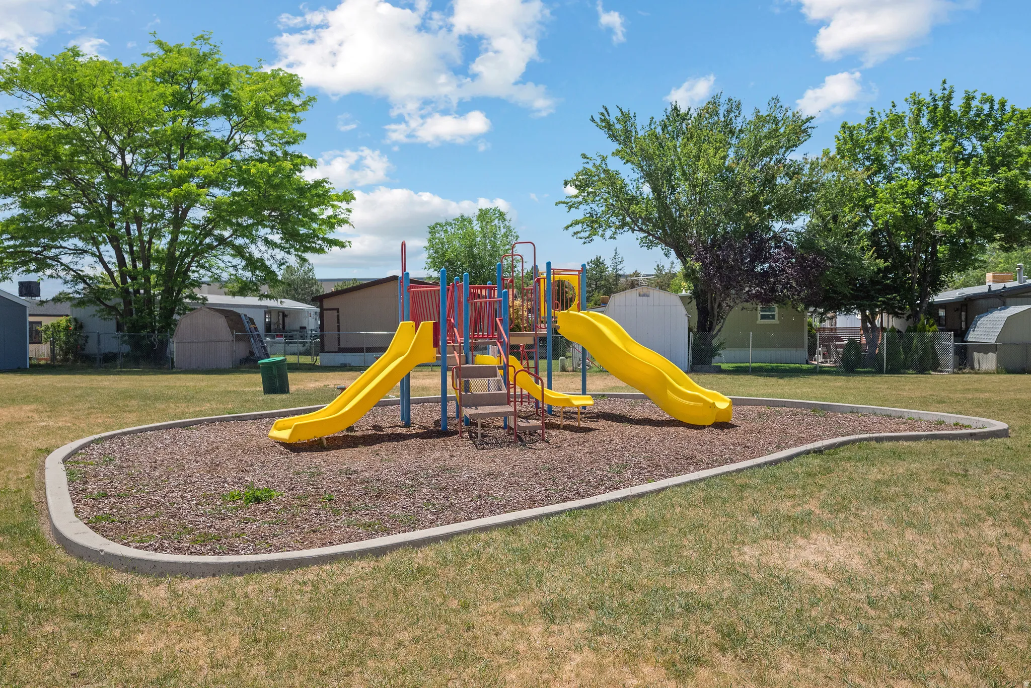 Recreational playground featuring multiple slides and climbing elements