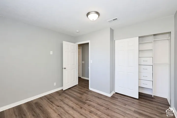 Neutral gray wall finishes complement the wood-finish flooring