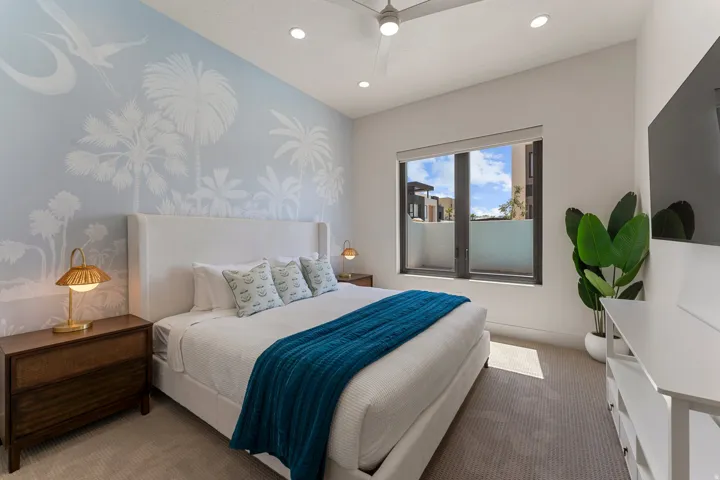 Bedroom featuring a light blue mural accent wall, recessed lighting, and a ceiling fan