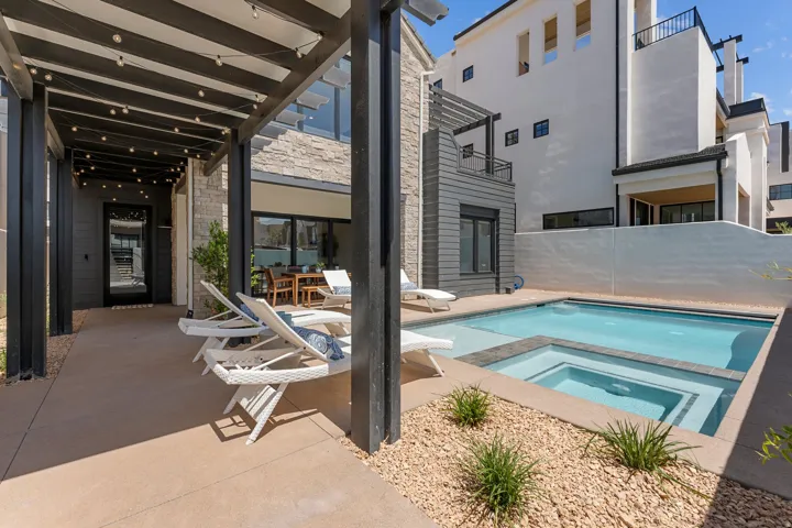 Private courtyard featuring a swimming pool with integrated spa