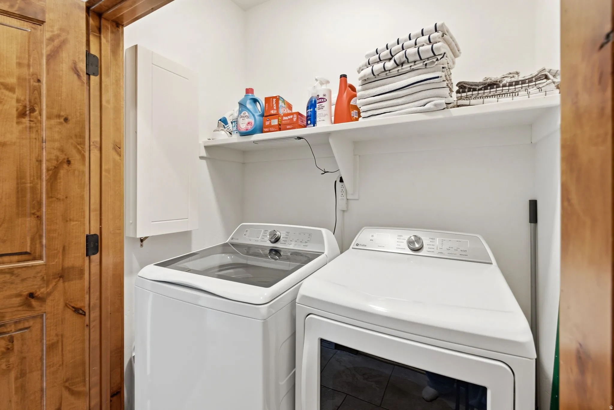 Dedicated laundry area featuring a freestanding washer and dryer