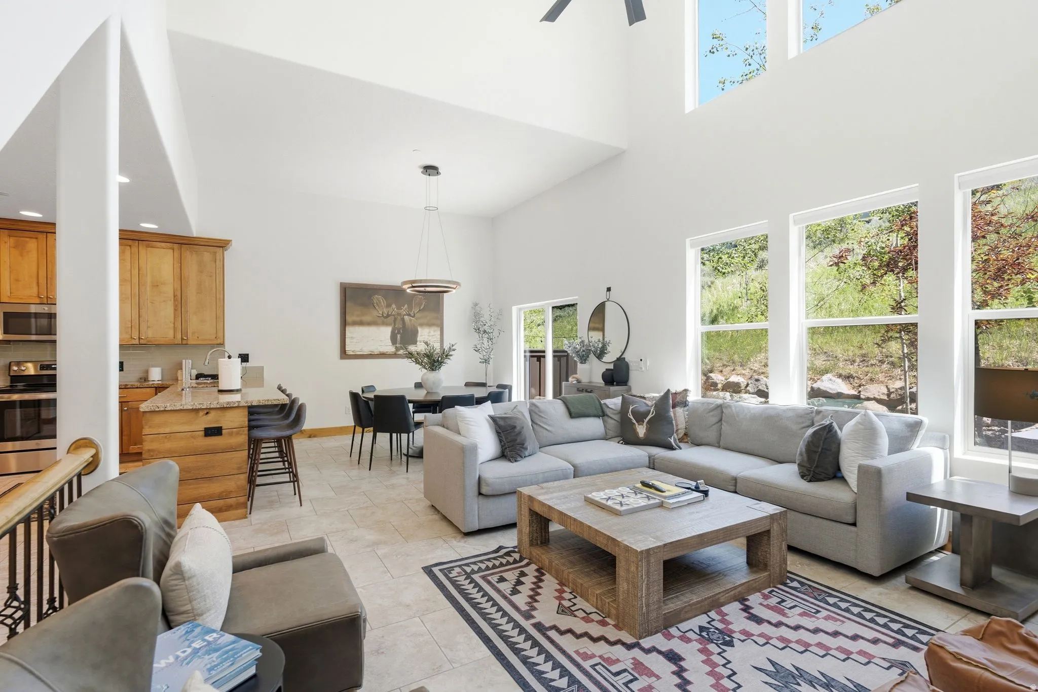 Vaulted ceilings and abundant natural light highlight this open concept living area