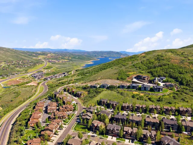 Aerial perspective showcasing a residential community nestled in a mountainous landscape