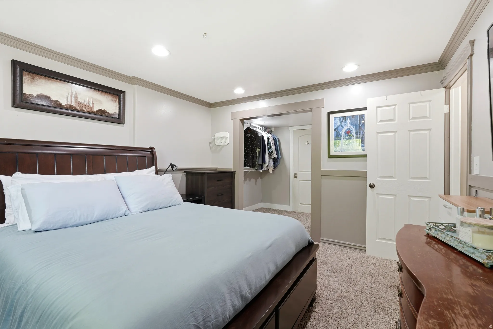 Bedroom featuring neutral wall paint, recessed lighting, and crown molding