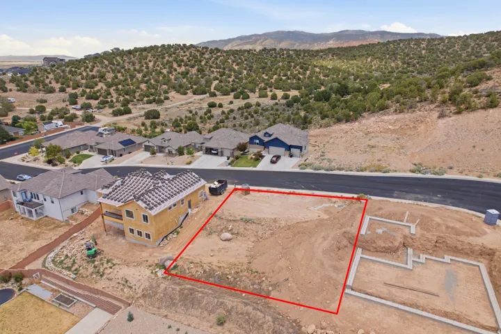 Expansive undeveloped lot with partial foundation work completed
