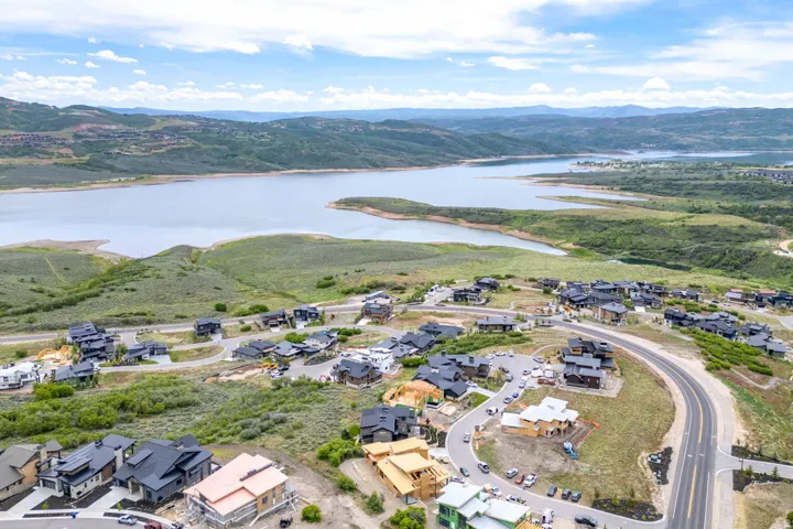 Aerial perspective showcasing a residential development with extensive water frontage