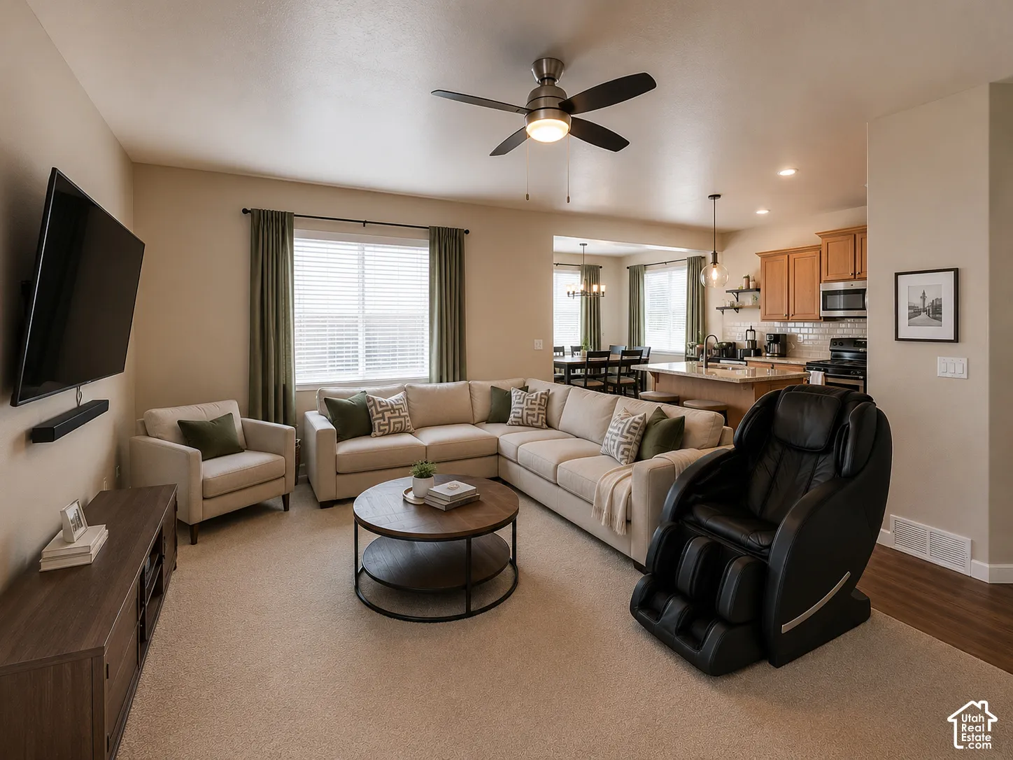 Open-concept living space featuring neutral-toned walls and carpeting