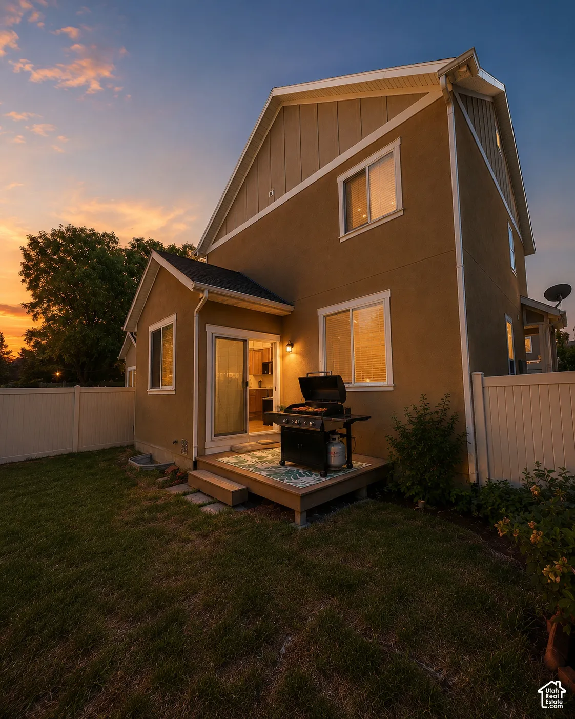 Rear exterior with stucco siding and multiple windows