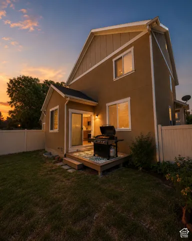 Rear exterior with stucco siding and multiple windows
