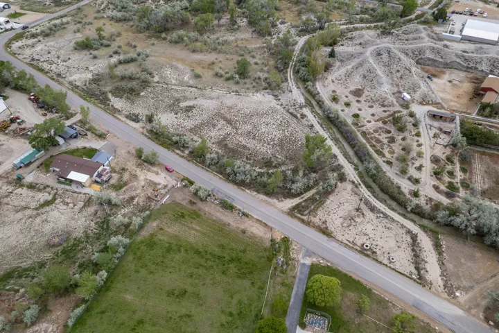 Aerial of property, neighborhood, canal and canal road.