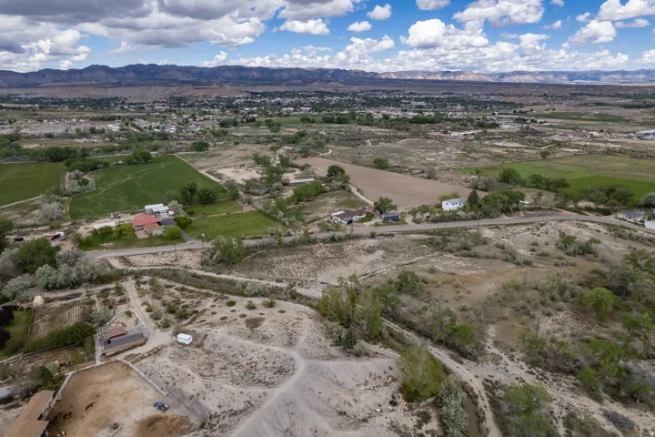 View of property with mountains in the distance and neighborhood view.