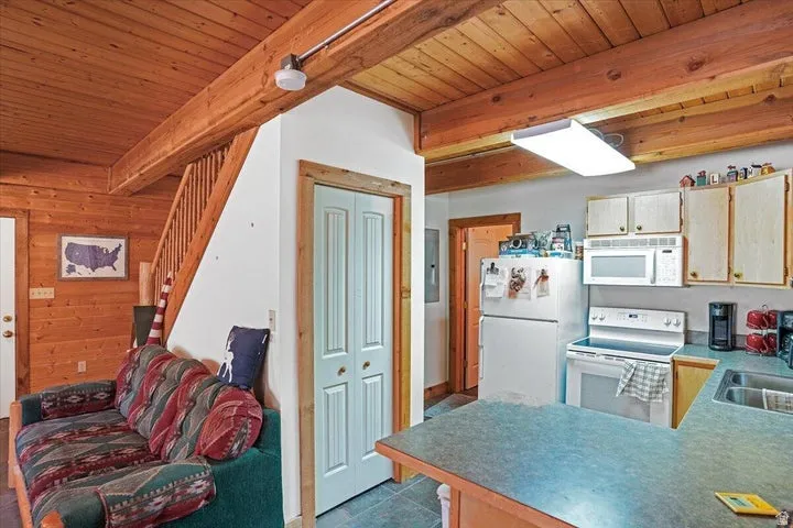 Exposed wood-beam ceiling with natural wood planking throughout