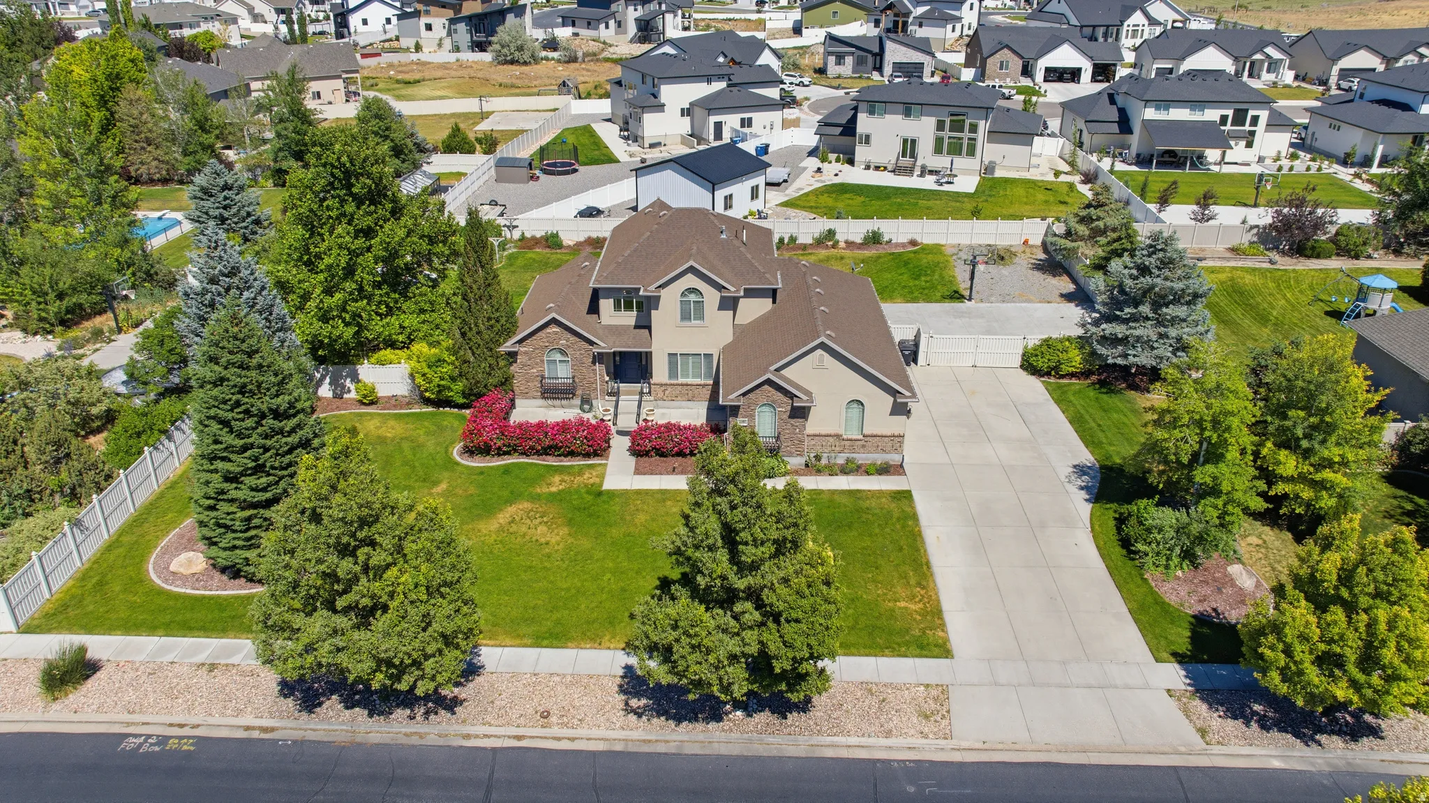 Stately residence with a multi-gabled roofline and a stone and stucco facade