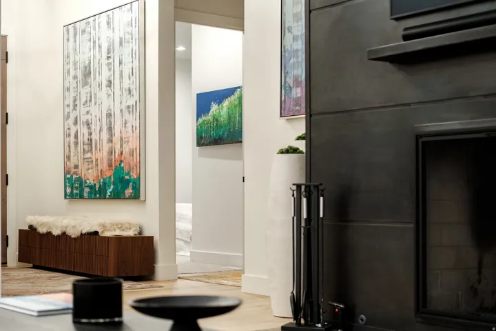 Modern fireplace surround with a dark finish, integrated mantel, and hearth