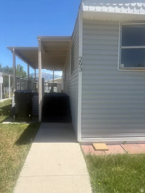 Light-colored horizontal siding exterior with white trim