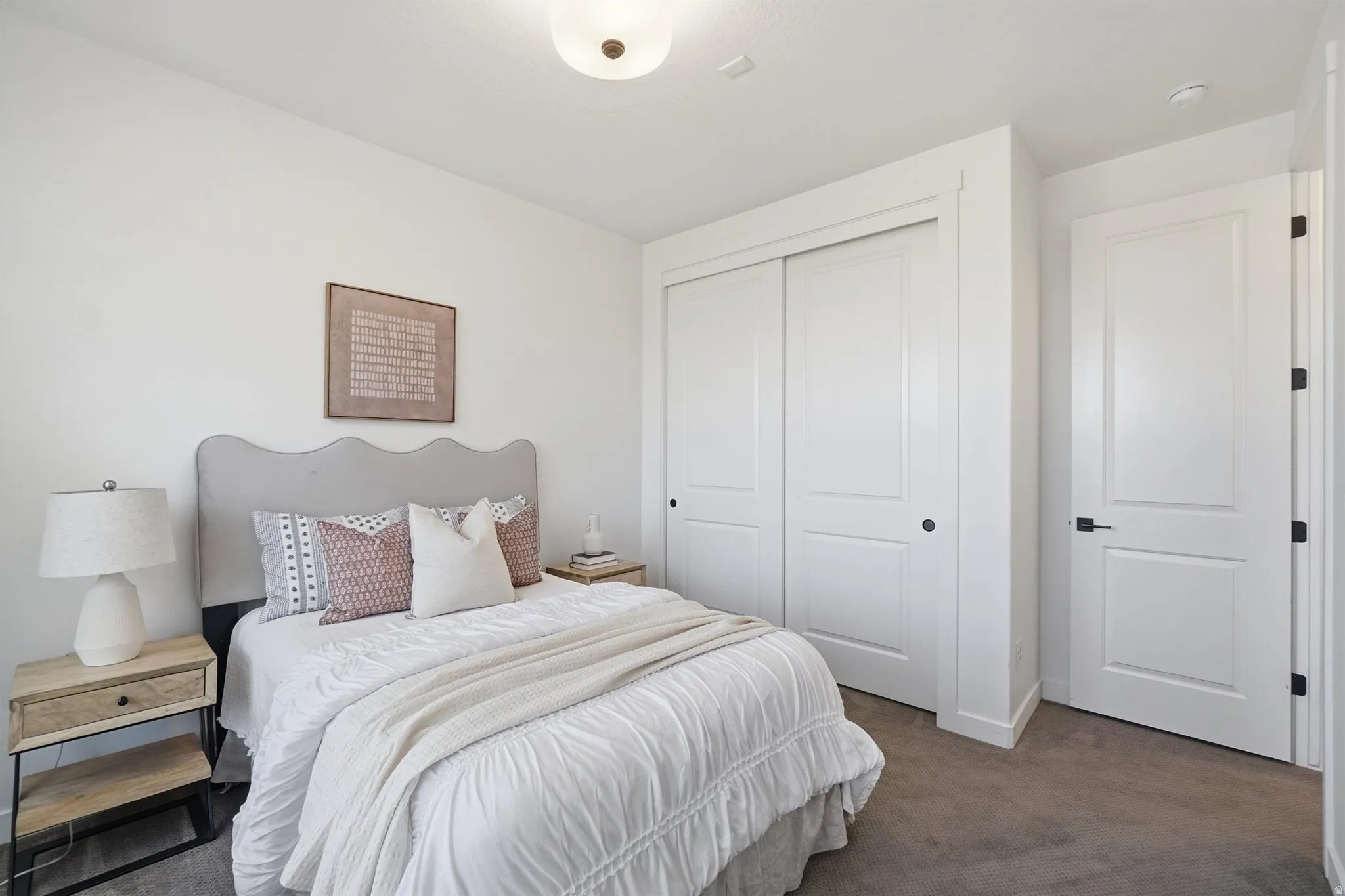 Neutral-toned wall paint and carpet flooring