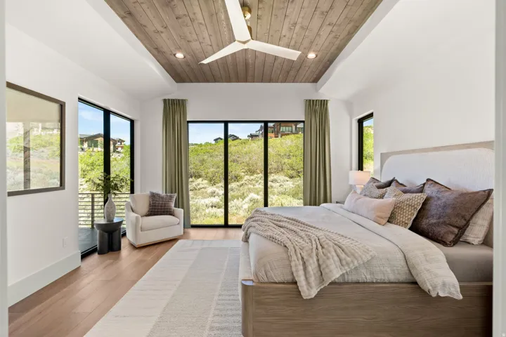 Tray ceiling with wood-finish paneling and recessed lighting
