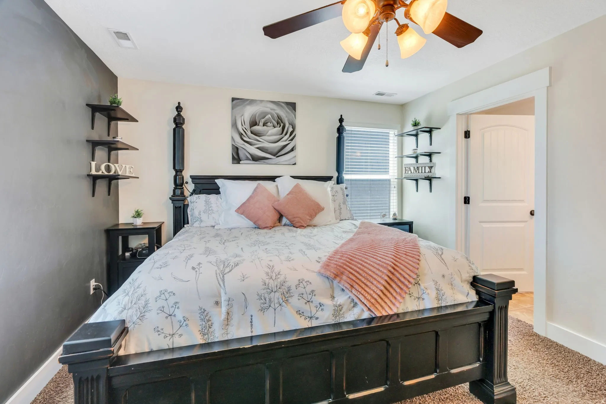 Bedroom featuring neutral wall colors, a ceiling fan with integrated lighting, and carpet flooring