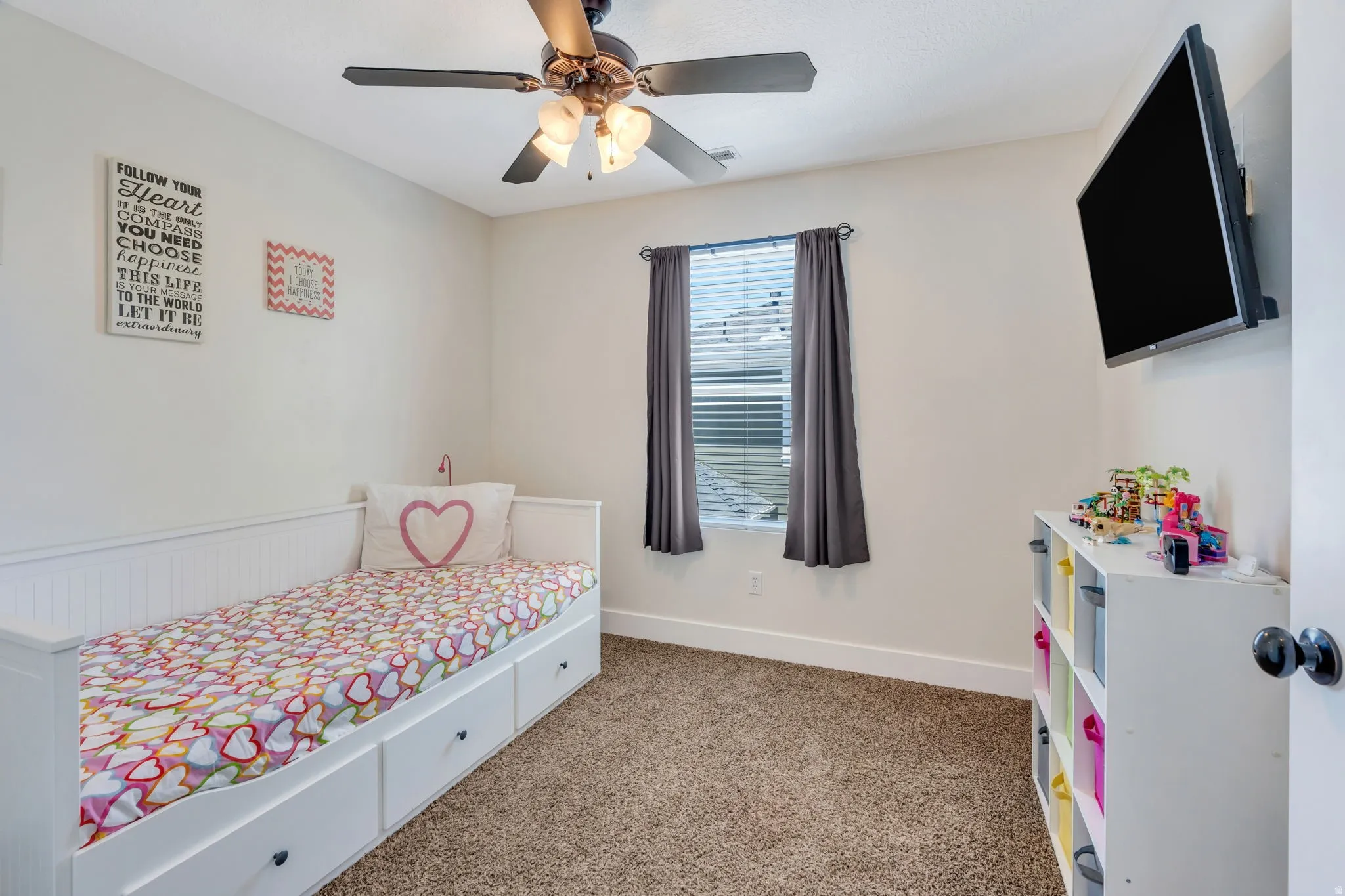 Interior room featuring neutral wall paint and plush carpet flooring