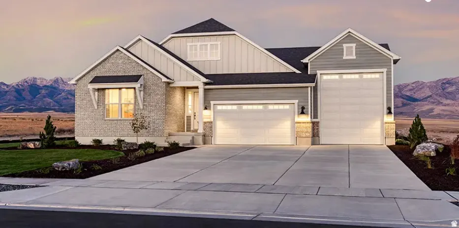 Contemporary facade featuring stone veneer and horizontal siding