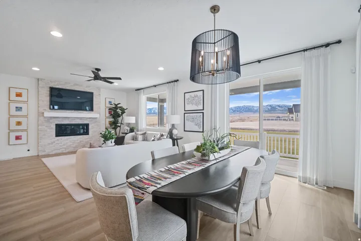 Open-concept living space with light wood-finish flooring