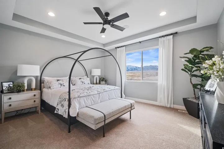 Expansive window framing a mountain and landscape backdrop