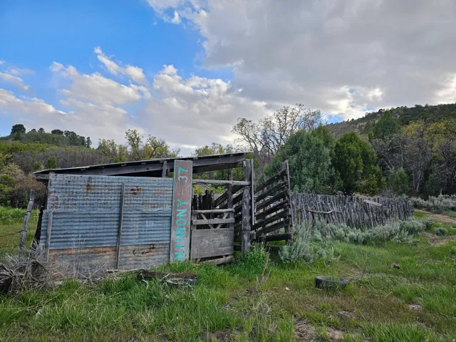 Rustic outbuilding featuring corrugated metal siding and a wood frame