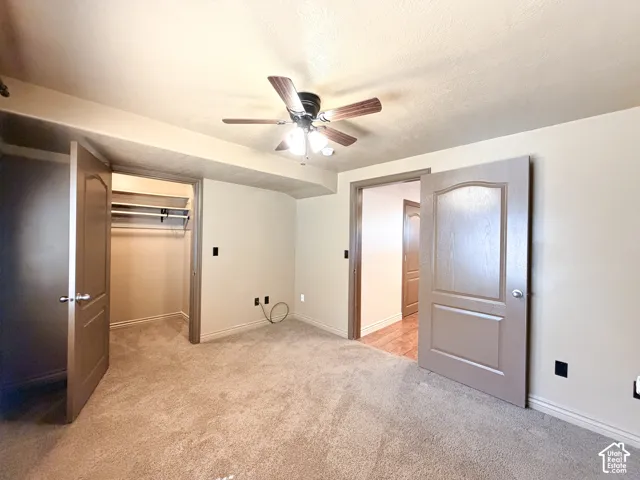 Bedroom 5 Warm-toned carpeting and neutral wall tones