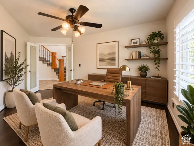 Dark wood-finish flooring, white plantation shutters, a ceiling fan with integrated lighting, and white French doors
