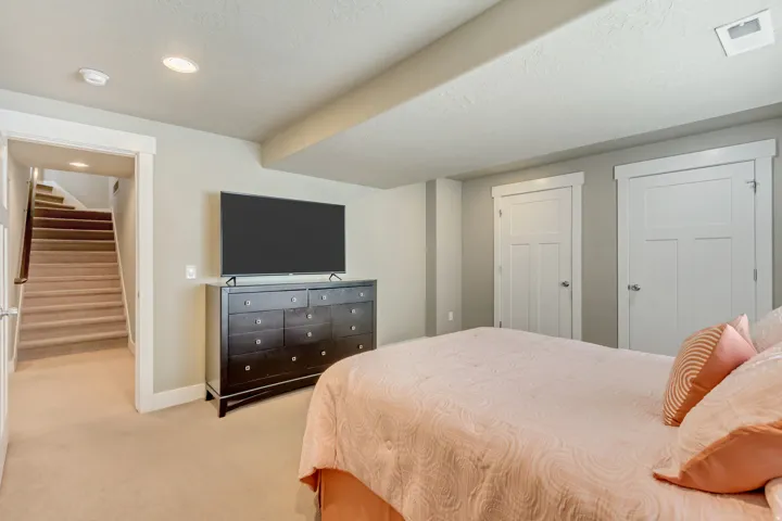 Carpeted room with recessed lighting and neutral wall tones