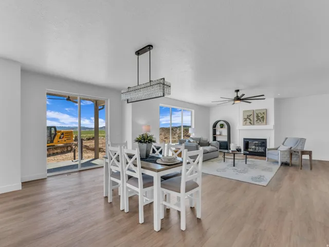 Open-concept living space featuring wood-finish flooring throughout