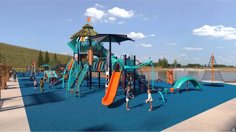 Expansive recreational area featuring a large central play structure with multiple slides and climbing elements, surrounded by a blue soft-fall surface