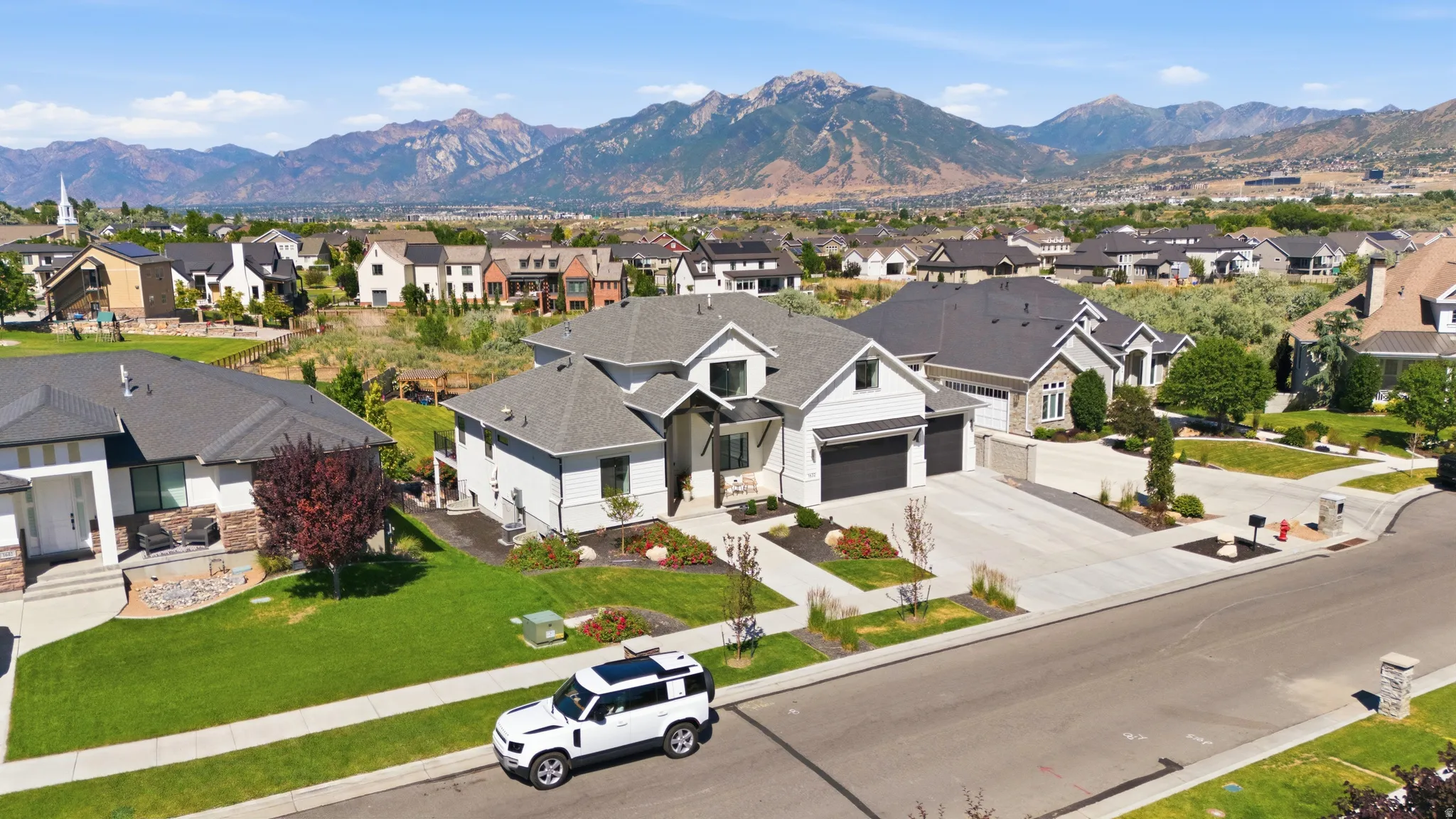 Modern residential community featuring a prominent mountain backdrop