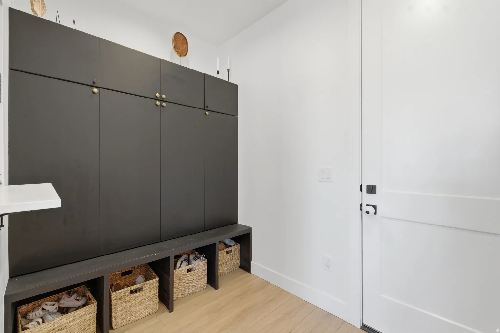 Built-in black cabinetry with gold-finish hardware