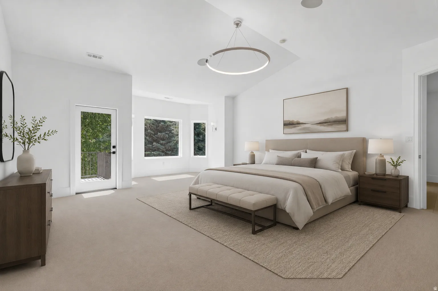 Virtually staged spacious bedroom featuring light-colored carpeting and white walls