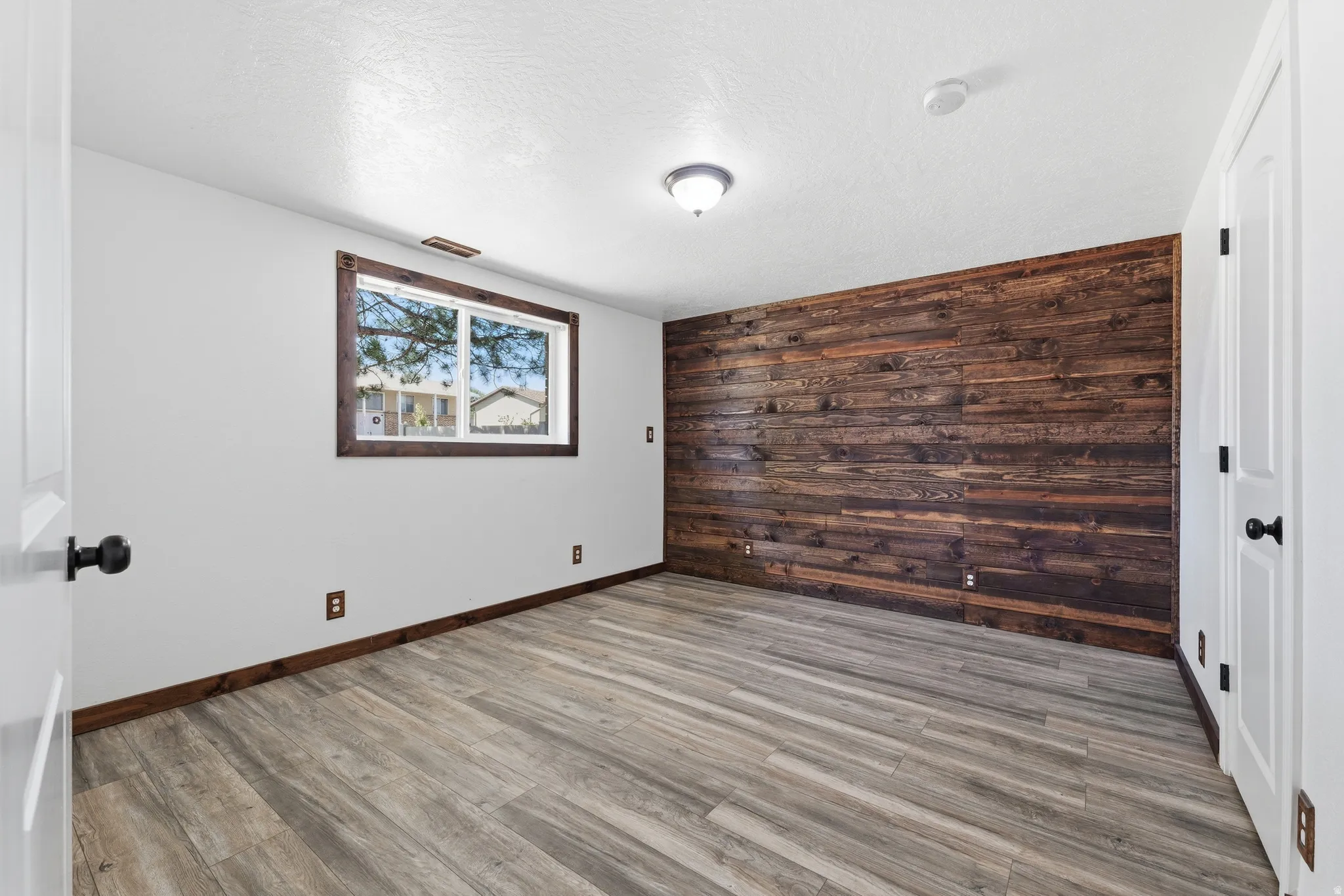 Accent wall featuring horizontal wood paneling
