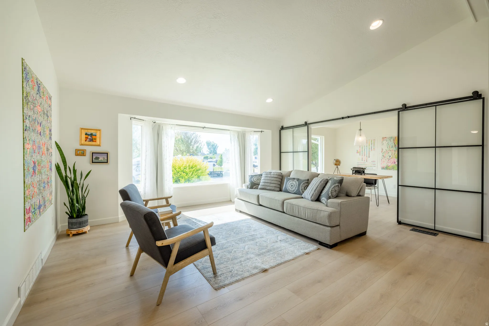 Great room with study featuring glass and metal doors