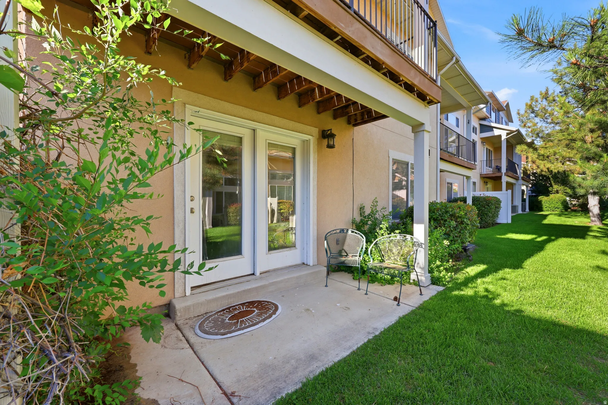Ground-level patio with dual-pane glass French doors