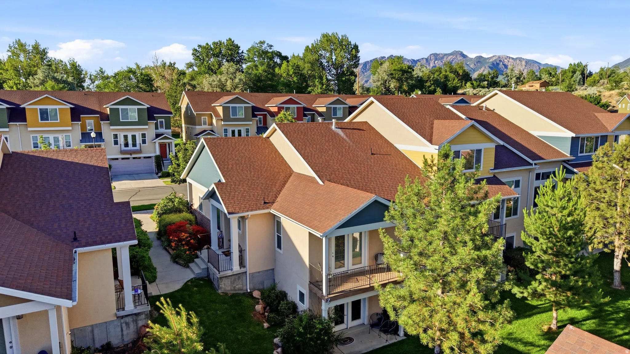 Townhome community featuring varied architectural styles and mature landscaping