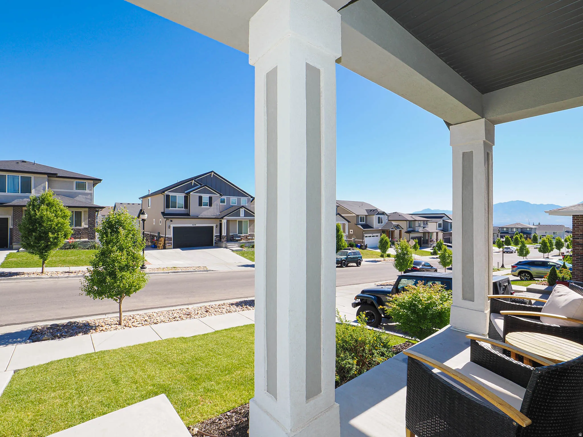 Covered front porch with mountain views